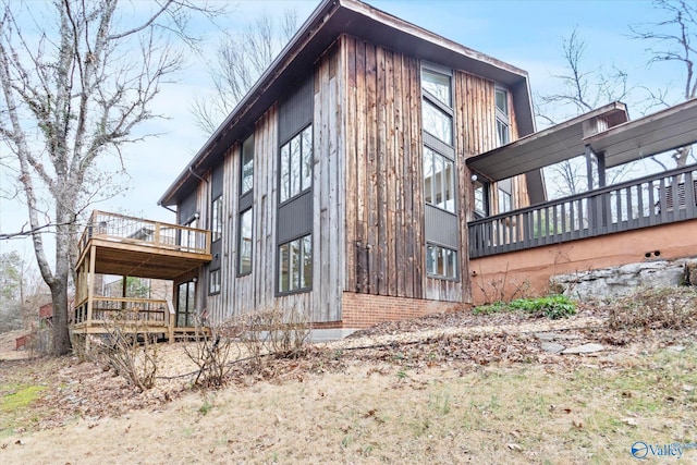 view of side of property featuring a deck