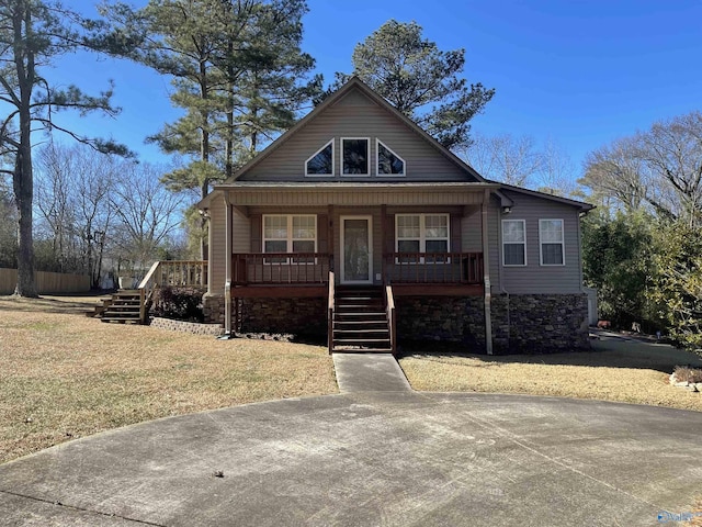 bungalow-style house with a front yard and a porch