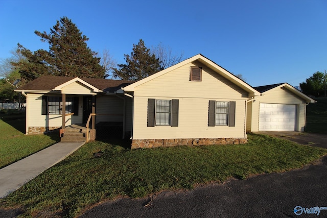 ranch-style home with a porch, aphalt driveway, a front lawn, and a garage