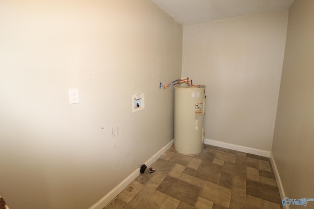 laundry area featuring water heater, washer hookup, baseboards, and laundry area