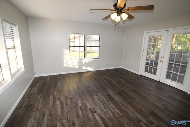 unfurnished room featuring dark wood-style flooring, baseboards, ceiling fan, and french doors
