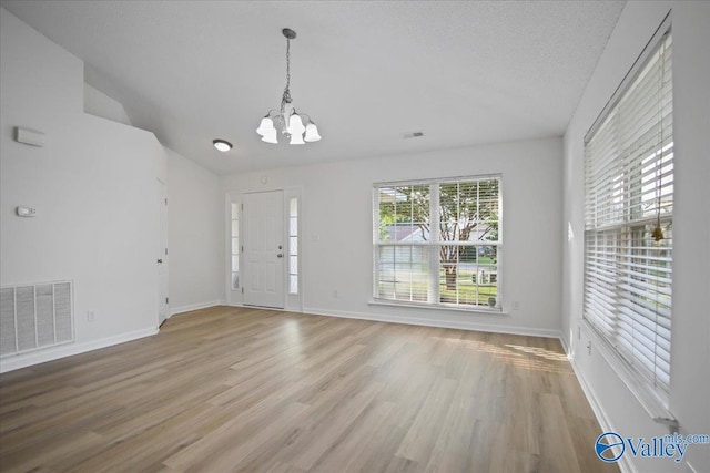 215 Shadow Ct SW, Huntsville, AL 35824 - foyer with a chandelier and light wood-type flooring