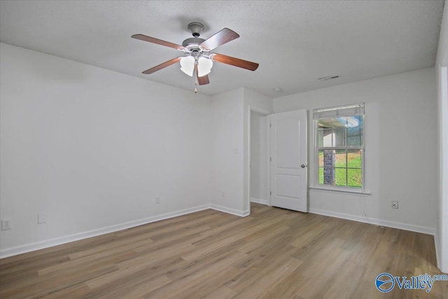 215 Shadow Ct SW, Huntsville, AL 35824 - empty room featuring wood finished floors and a ceiling fan