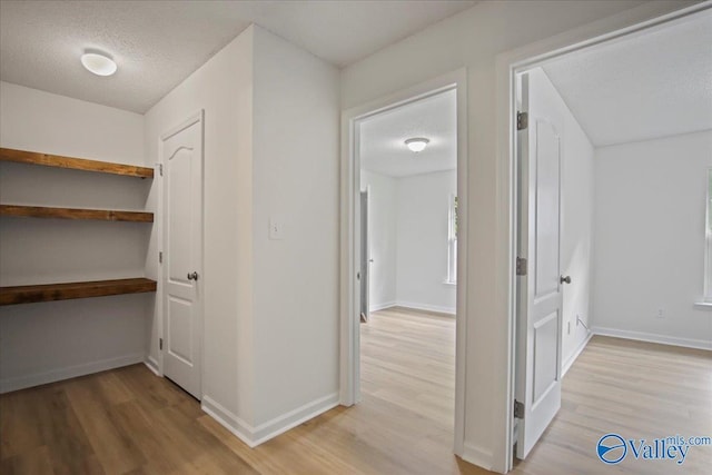 215 Shadow Ct SW, Huntsville, AL 35824 - hall featuring light wood-style flooring and a textured ceiling