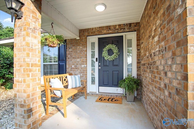 215 Shadow Ct SW, Huntsville, AL 35824 - entrance to property with brick siding and a porch