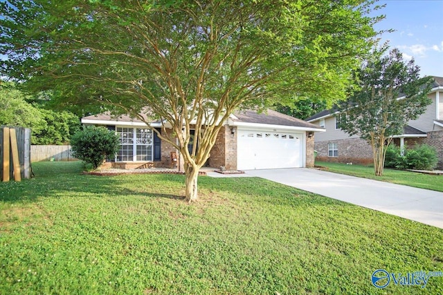 215 Shadow Ct SW, Huntsville, AL 35824 - view of front of house with an attached garage, driveway, and brick siding