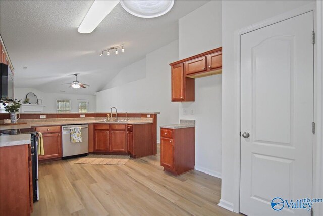 215 Shadow Ct SW, Huntsville, AL 35824 - kitchen with stainless steel appliances, light wood-style floors, ceiling fan, brown cabinetry, and vaulted ceiling