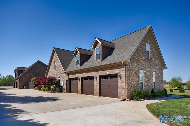 24188 Newby Rd, Madison, AL 35756 - view of home's exterior featuring brick siding, driveway, a shingled roof, and a garage