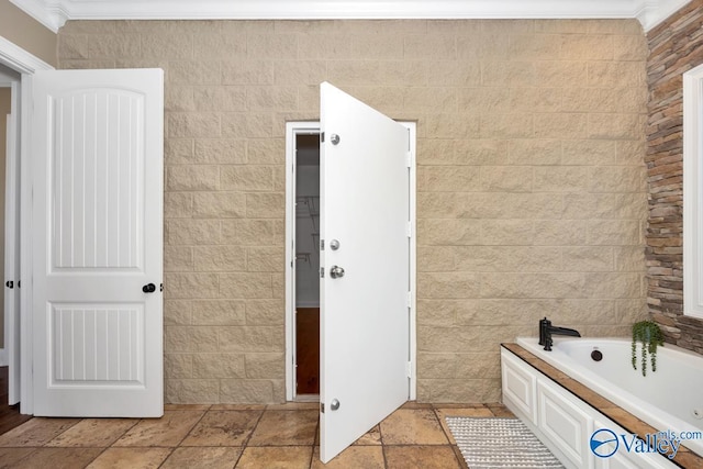24188 Newby Rd, Madison, AL 35756 - full bathroom featuring stone tile floors, a garden tub, and ornamental molding