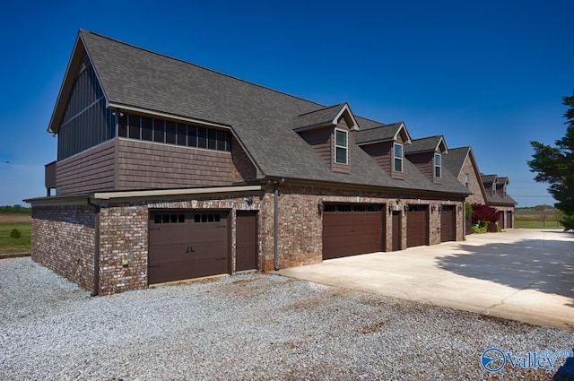 24188 Newby Rd, Madison, AL 35756 - view of front of house featuring brick siding, a shingled roof, a garage, and concrete driveway