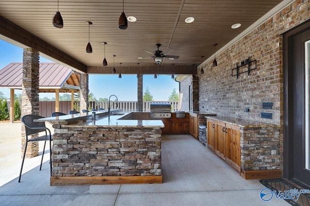 24188 Newby Rd, Madison, AL 35756 - view of patio with a sink, outdoor wet bar, fence, an outdoor kitchen, and area for grilling