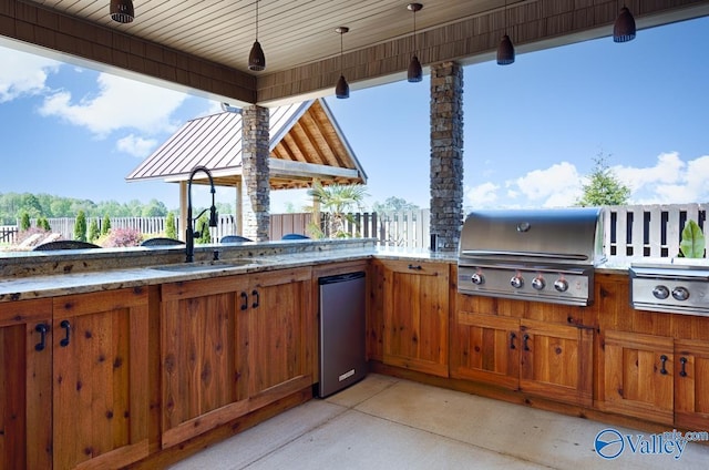 24188 Newby Rd, Madison, AL 35756 - view of patio with grilling area, fence, an outdoor kitchen, and a sink