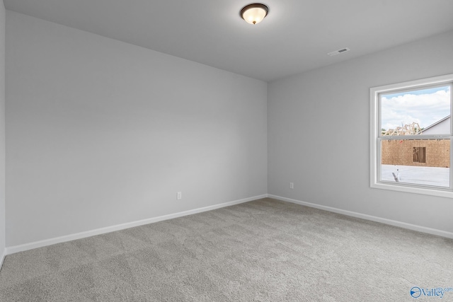 unfurnished room with carpet floors