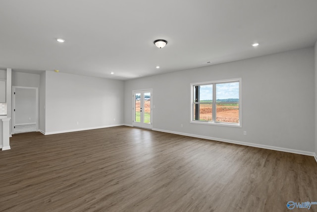 unfurnished room with french doors and dark hardwood / wood-style floors