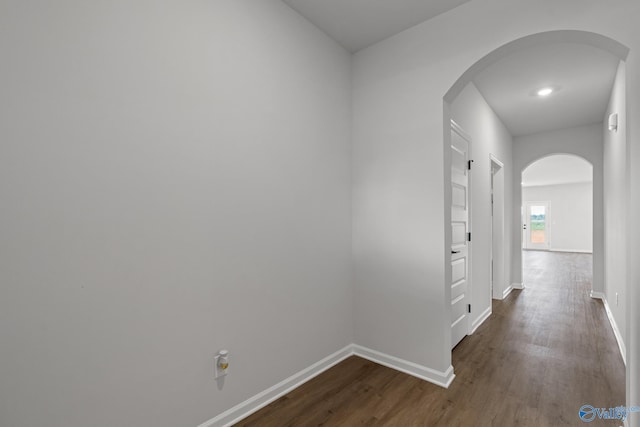 hallway featuring dark hardwood / wood-style flooring