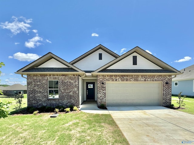 view of front of house with a front yard, concrete driveway, brick siding, a shingled roof, and a garage