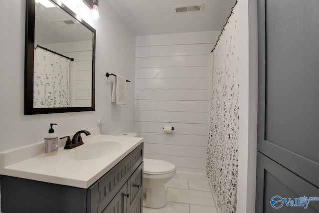 full bath with vanity, a shower with shower curtain, wooden walls, visible vents, and toilet