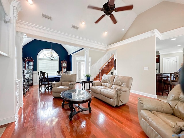 1103 Blackbriar Cir, Hartselle, AL 35640 - living room featuring lofted ceiling, ornate columns, ceiling fan, stairway, and hardwood / wood-style flooring