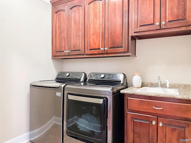 1103 Blackbriar Cir, Hartselle, AL 35640 - laundry room with washing machine and clothes dryer, cabinet space, and baseboards