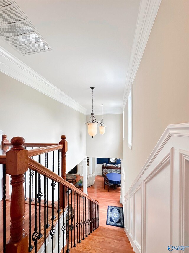 1103 Blackbriar Cir, Hartselle, AL 35640 - stairs featuring wood finished floors and crown molding