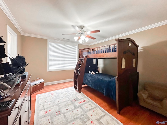 1103 Blackbriar Cir, Hartselle, AL 35640 - bedroom with light wood-type flooring, crown molding, baseboards, and a ceiling fan