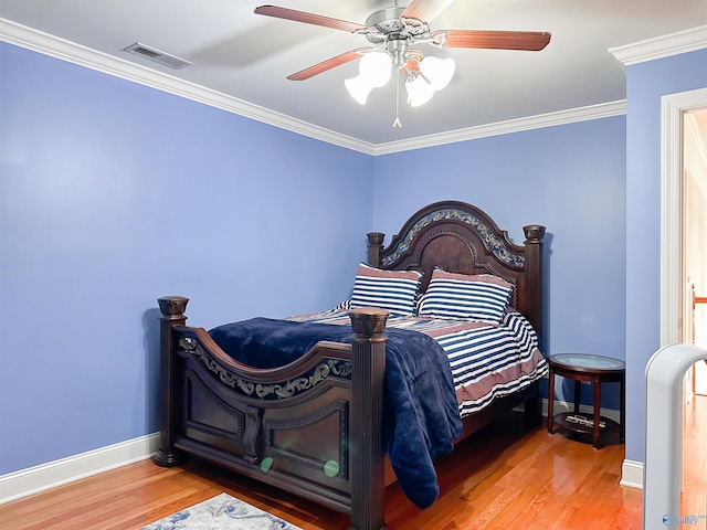 1103 Blackbriar Cir, Hartselle, AL 35640 - bedroom featuring baseboards, wood finished floors, crown molding, and ceiling fan