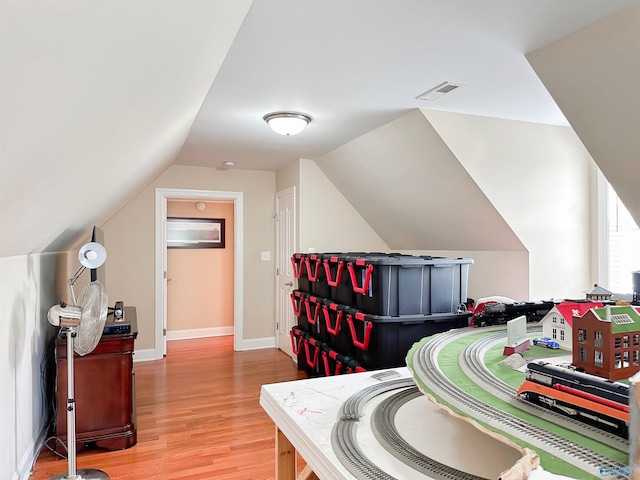 1103 Blackbriar Cir, Hartselle, AL 35640 - playroom with light wood-type flooring, lofted ceiling, and baseboards