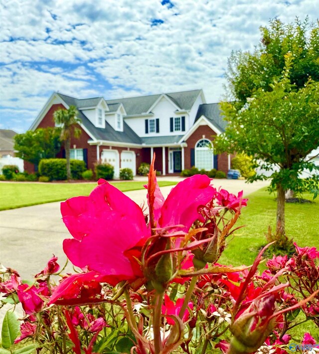 1103 Blackbriar Cir, Hartselle, AL 35640 - view of front of property with a garage, a front yard, and driveway