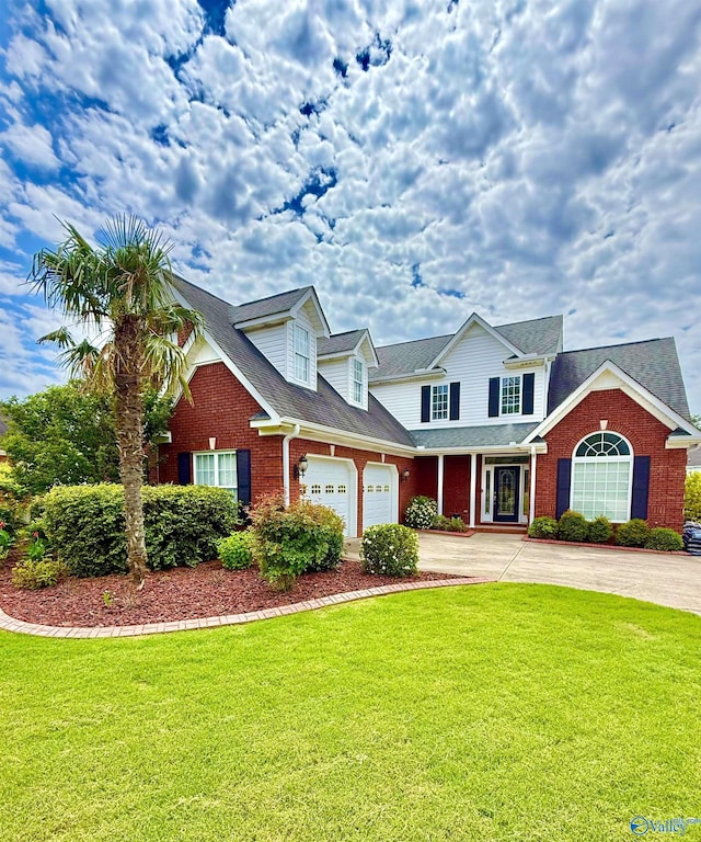 1103 Blackbriar Cir, Hartselle, AL 35640 - view of front of home featuring brick siding, concrete driveway, and a front yard