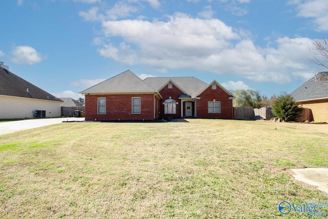 single story home with brick siding, central air condition unit, a front lawn, and fence