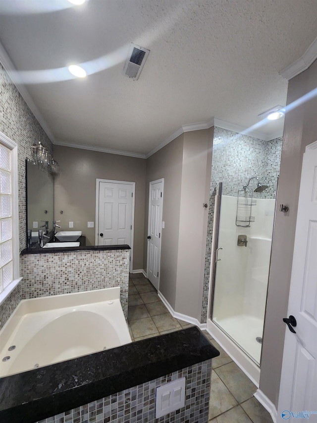 bathroom featuring crown molding, visible vents, tile patterned flooring, and a stall shower