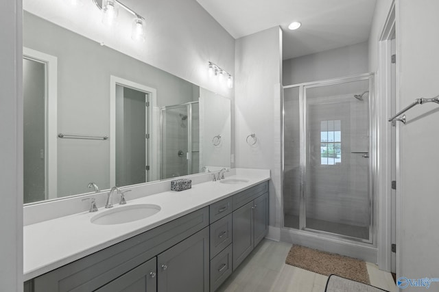 bathroom with vanity and an enclosed shower