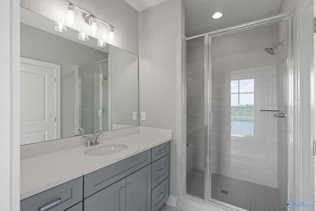 bathroom with vanity and an enclosed shower