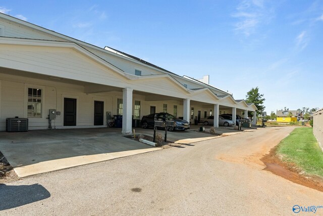 view of building exterior with central air condition unit