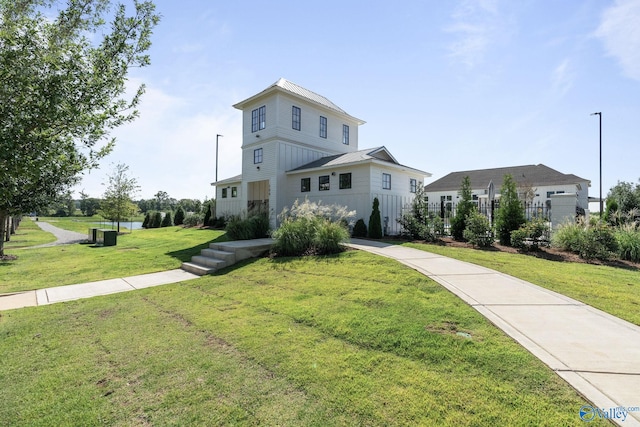 view of front of home with a front lawn