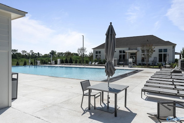 view of swimming pool with a patio