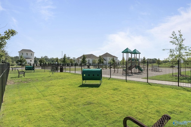 view of community with a playground and a yard