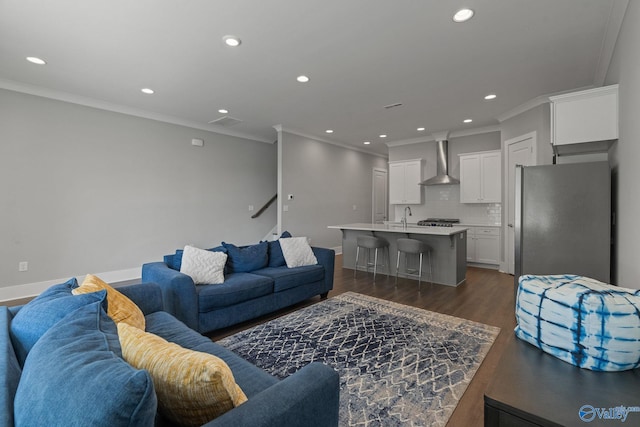 living room featuring dark hardwood / wood-style floors and crown molding