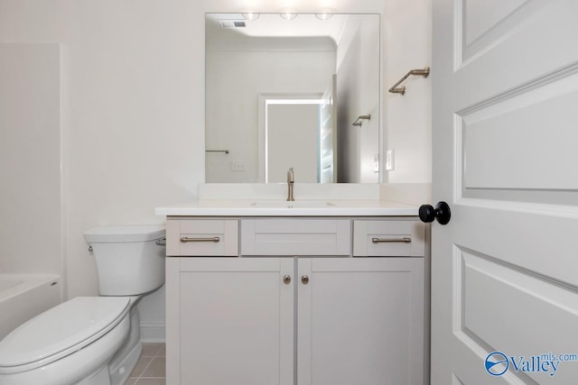 full bathroom with vanity, tile patterned floors, bathing tub / shower combination, and toilet