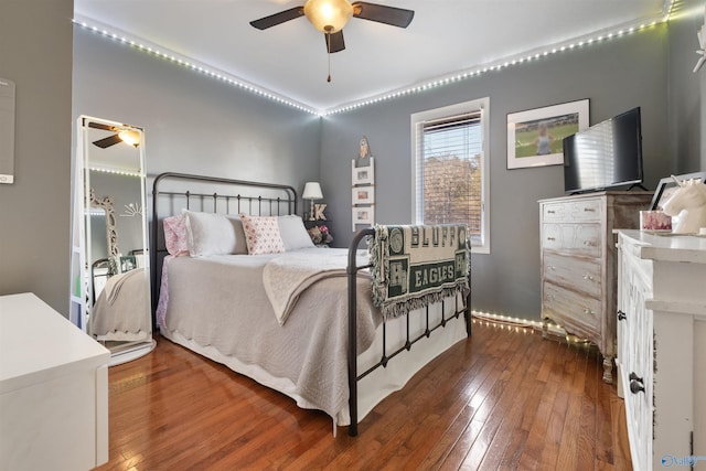 bedroom featuring ceiling fan and dark wood-type flooring