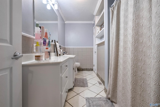 bathroom with toilet, tile walls, tile patterned floors, ornamental molding, and a textured ceiling