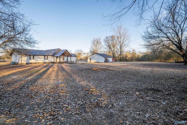 view of front of house featuring an outdoor structure and a garage