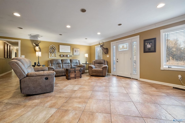 living room with light tile patterned floors and crown molding