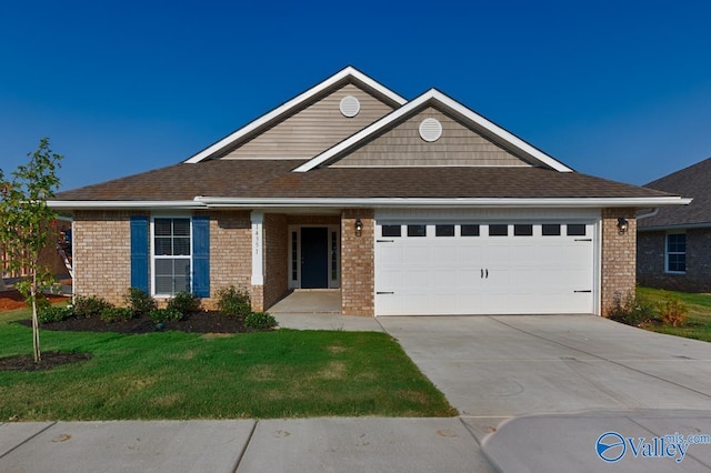 view of front of property featuring a garage and a front lawn