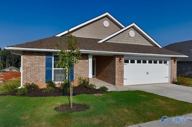 view of front of home featuring a front yard and a garage