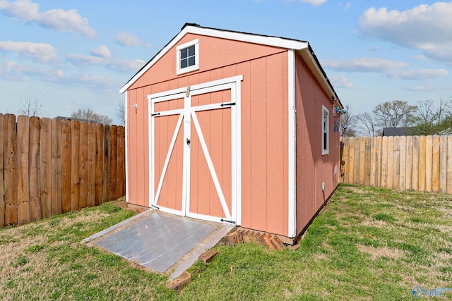view of shed featuring a fenced backyard