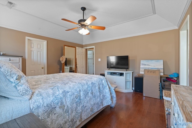 bedroom with a ceiling fan, dark wood-style flooring, crown molding, and visible vents