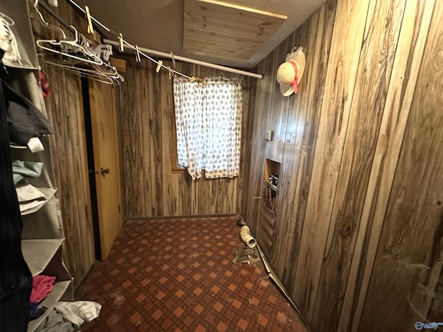 interior space featuring wood walls