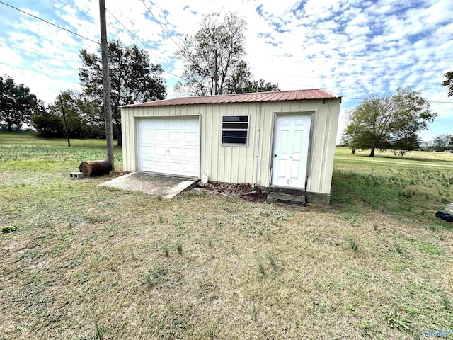 garage with a lawn