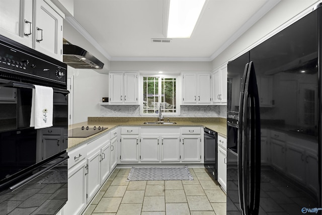 kitchen featuring crown molding, white cabinets, a sink, and black appliances